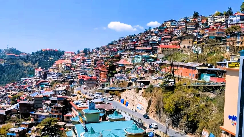 Colourful houses stacked on a hillside in Shimla, Himachal Pradesh