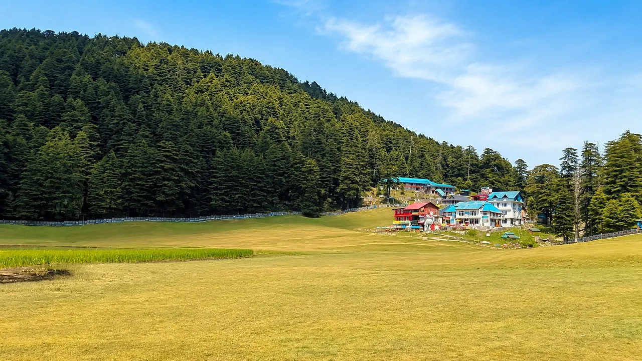 Grassy Khajjiar meadow with deodar forest and a hotel near Dalhousie