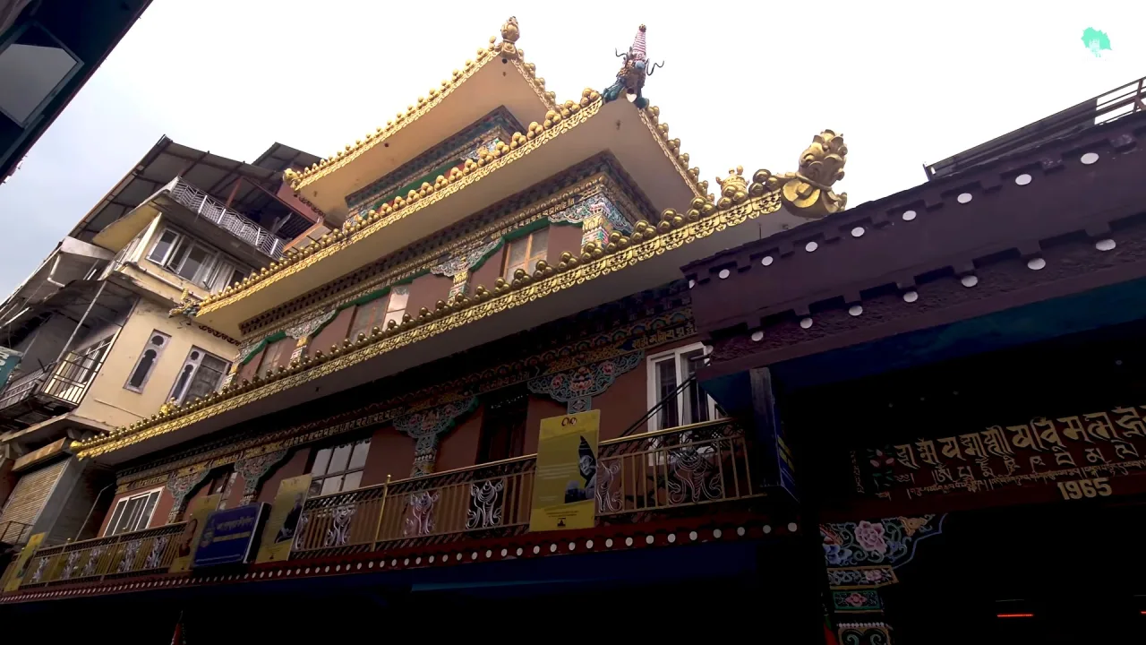 Tibetan monastery building with a golden roof in McLeod Ganj