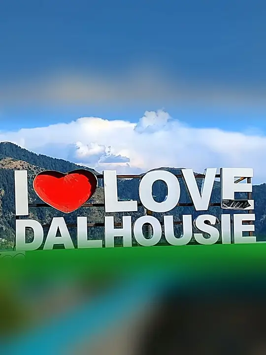 I Love Dalhousie sign against a blue mountain sky