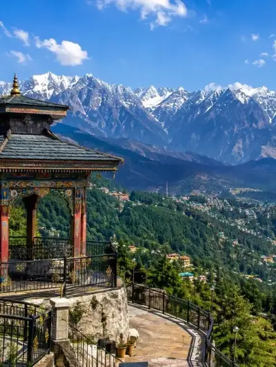 Tibetan-style viewpoint pavilion facing the snowy Dhauladhar range at Dharamshala