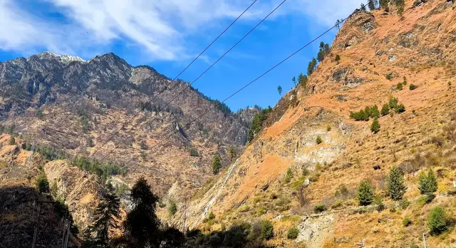 Dry autumn hills and blue sky in the Parvati valley near Kasol