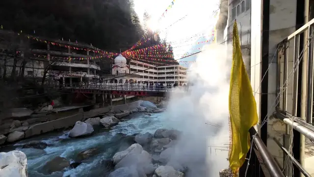 Hot spring steam over the Parvati River below Gurudwara Manikaran Sahib