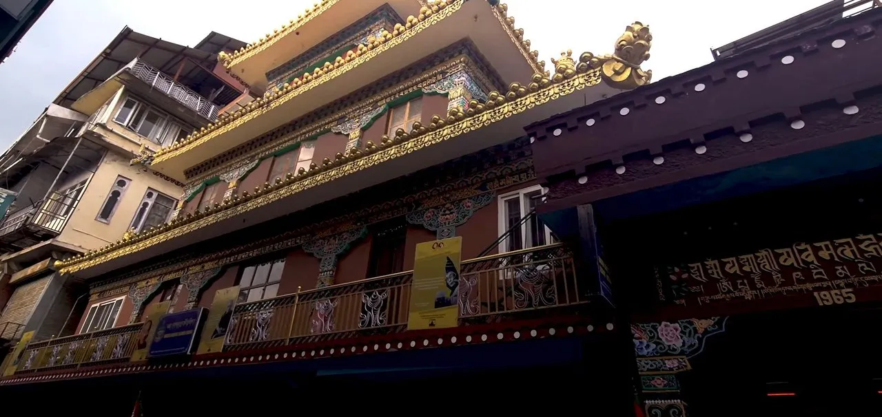 Tibetan monastery building with a golden roof in McLeod Ganj