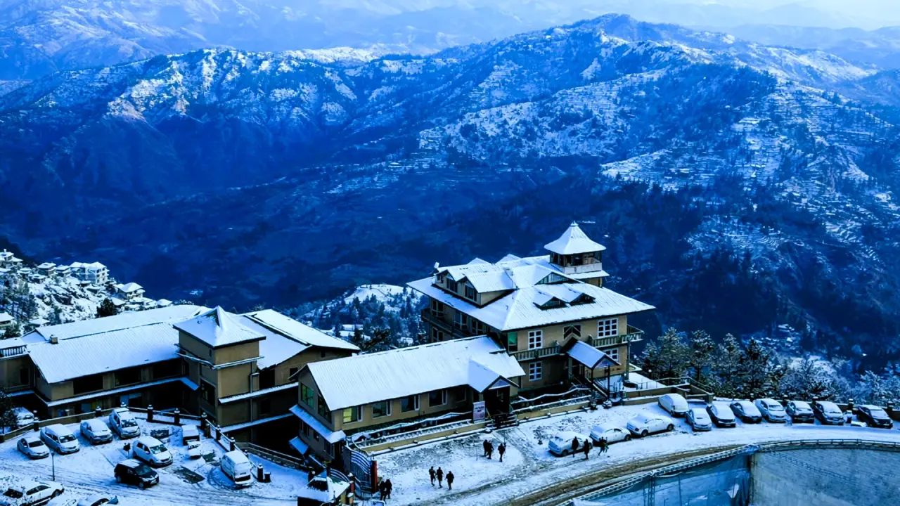 Snow-covered hill hotel overlooking the Shimla valley in winter