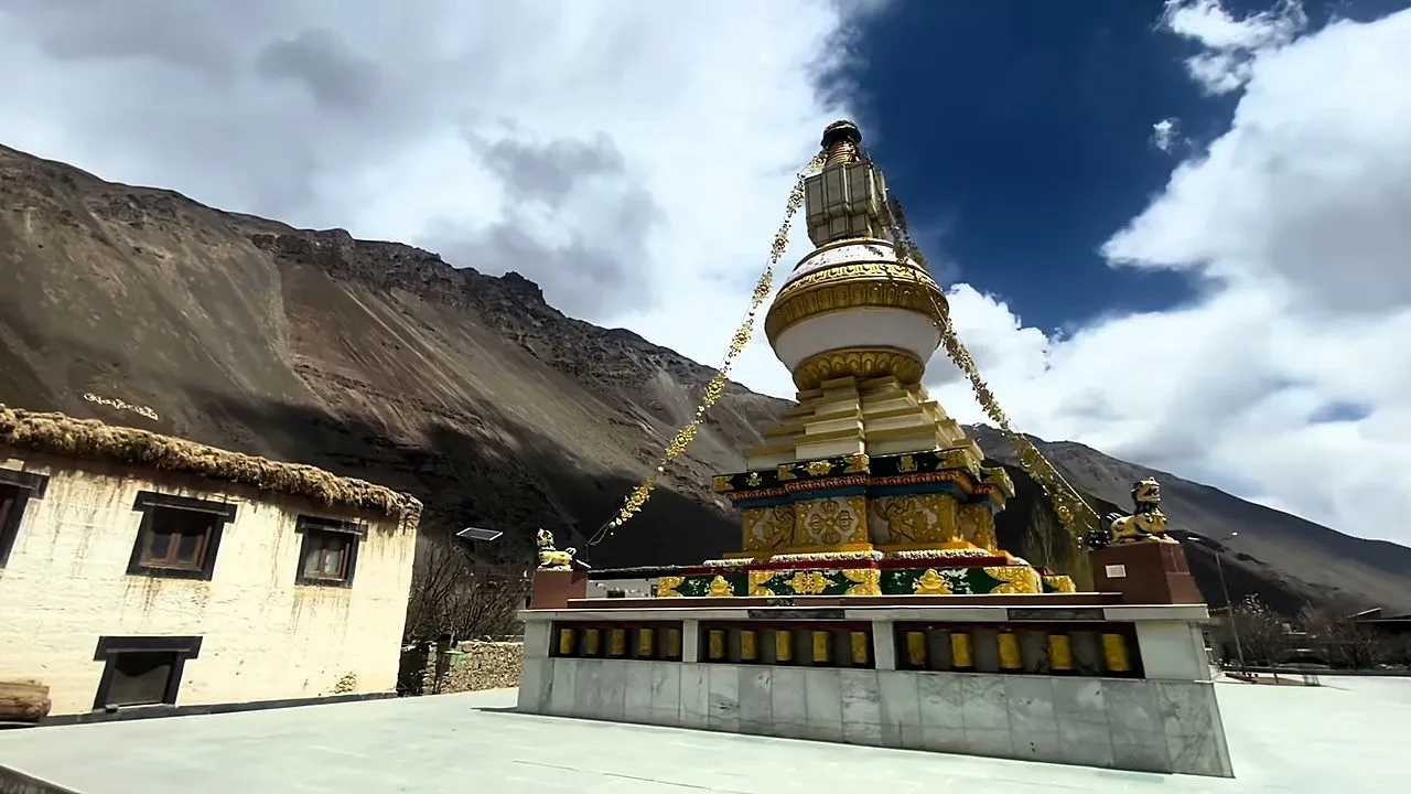 Golden Buddhist stupa below bare mountains in Spiti Valley